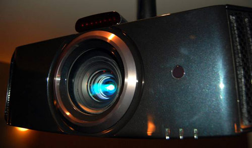 JVC DLA-X3 shown with 3D transmitter placed on top of the projector